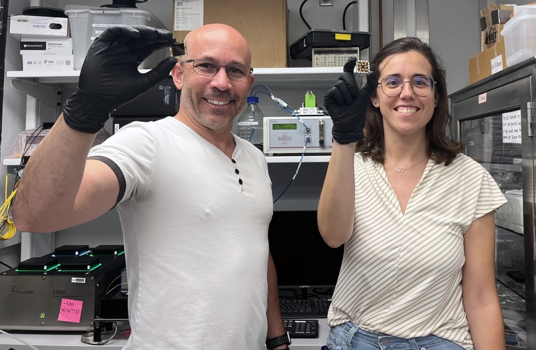 GIFT teachers holding computing chip in a Georgia Tech lab.